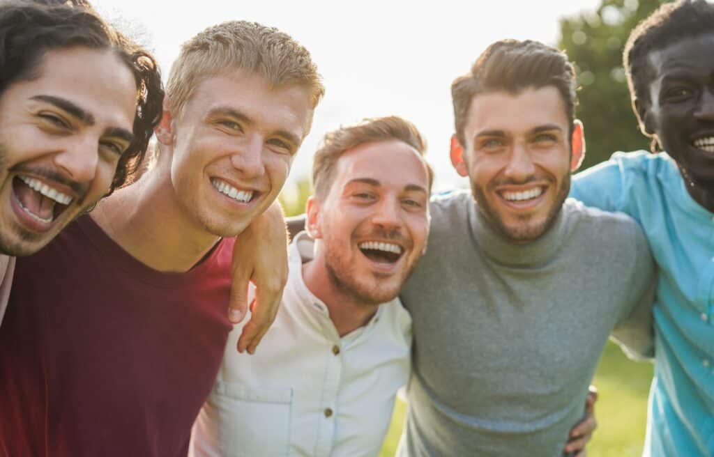 Group of young men talking about Mental Health Services for Young Adults.