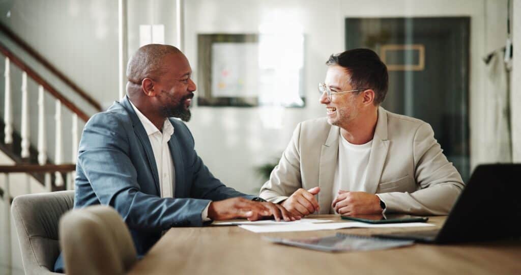 Two professional men talking at Mental Health for Working Professionals.